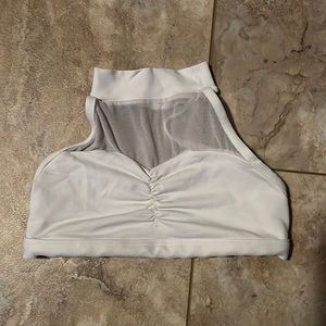 White dance top with mesh upper. Size S. Collar snaps around neck. Open back.